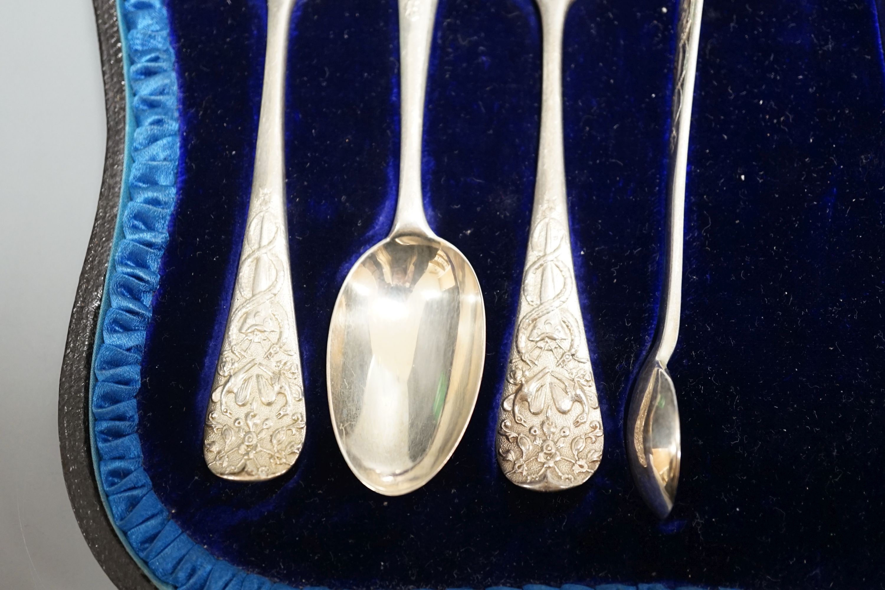 A cased set of six late Victorian silver teaspoons with sugar tongs, London, 1898.